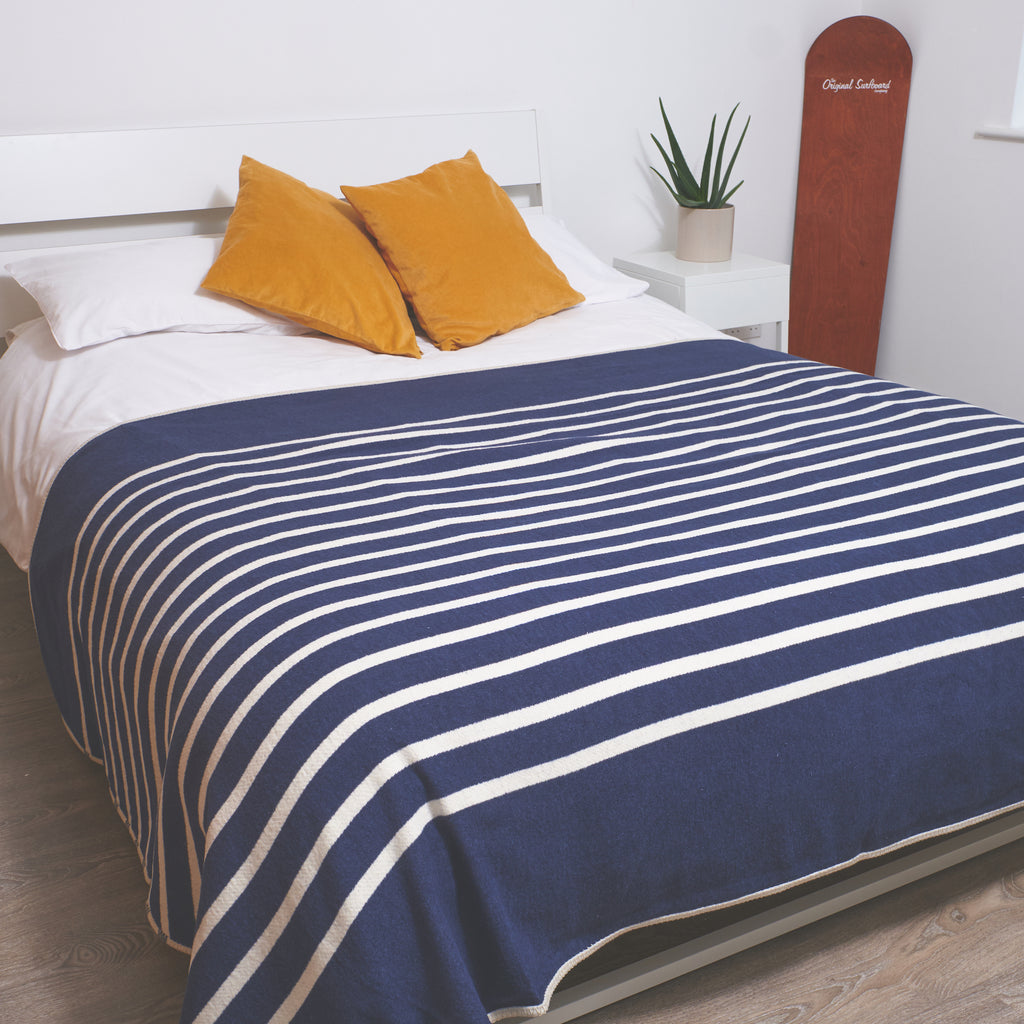 king sized bed blanket in a navy and cream stripe design