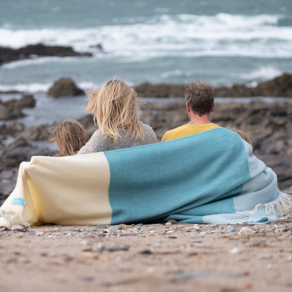 family wrapped in noon tides herringbone wool blanket 